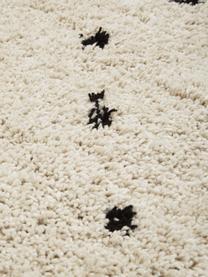 Pluizig hoogpolig vloerkleed Ayana, met stippels, Bovenzijde: 100% polyester, Onderzijde: 100% katoen, Beige & zwart, met stippels, B 80 x L 150 cm (maat XS)