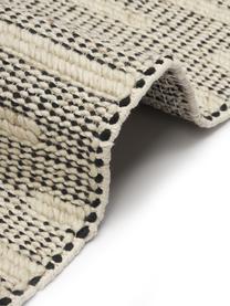 Ručne tkaný vlnený koberec so strapcami Rue, 50 %  vlna, 50 % bavlna

V prvých týždňoch používania môžu vlnené koberce uvoľňovať vlákna, tento jav po čase zmizne, Béžová, čierna, Š 80 x D 150 cm (veľkosť XS)