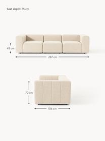 Divano componibile 4 posti in bouclé Lena, Rivestimento: bouclé (93% poliestere, 6, Struttura: legno di faggio, truciola, Piedini: plastica, Bouclé beige chiaro, Larg. 287 x Prof. 106 cm