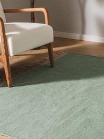 Ręcznie tkany dywan z wełny Liv, 80% wełna, 20% bawełna

Włókna dywanów wełnianych mogą nieznacznie rozluźniać się w pierwszych tygodniach użytkowania, co ustępuje po pewnym czasie, Szałwiowy zielony, S 80 x D 150 cm (Rozmiar XS)