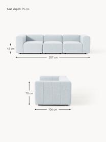 Divano componibile 4 posti in bouclé Lena, Rivestimento: bouclé (93% poliestere, 6, Struttura: legno di faggio, truciola, Piedini: plastica, Bouclé azzurro, Larg. 287 x Prof. 106 cm