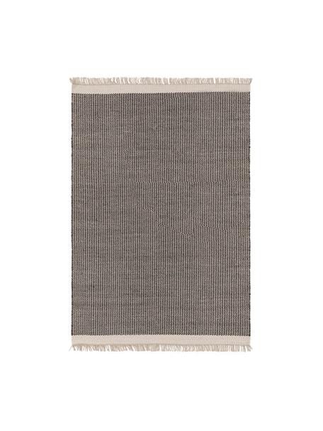 Ręcznie tkany dywan z wełny z frędzlami Kim, 80% wełna, 20% bawełna

Włókna dywanów wełnianych mogą nieznacznie rozluźniać się w pierwszych tygodniach użytkowania, co ustępuje po pewnym czasie, Czarny, beżowy, S 80 x D 120 cm (Rozmiar XS)
