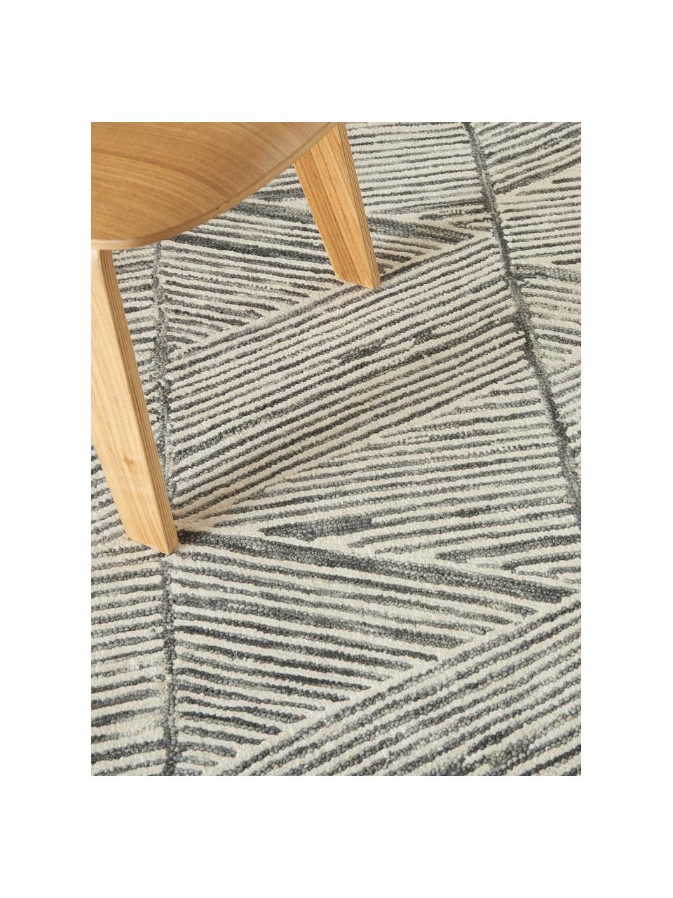 Tapis en laine tissé à la main Colorado, 100 % laine

Les tapis en laine peuvent perdre des fibres lors des premières semaines et des peluches peuvent se former, ce phénomène est naturel et diminue à mesure de votre usage et du temps, Blanc crème, gris foncé, larg. 120 x long. 180 cm (taille S)