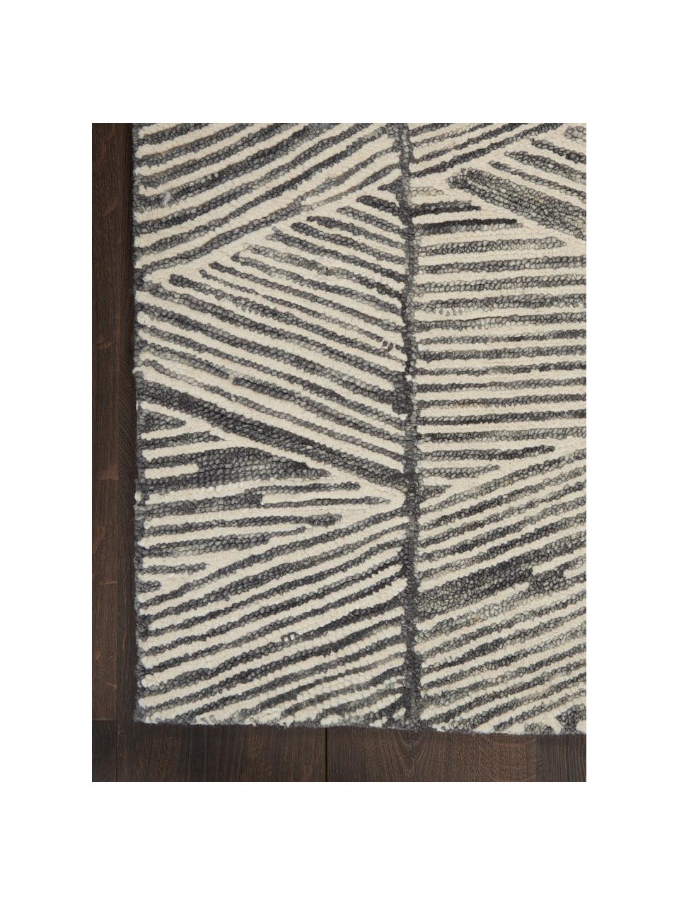 Tapis en laine tissé à la main Colorado, 100 % laine

Les tapis en laine peuvent perdre des fibres lors des premières semaines et des peluches peuvent se former, ce phénomène est naturel et diminue à mesure de votre usage et du temps, Blanc crème, gris foncé, larg. 120 x long. 180 cm (taille S)