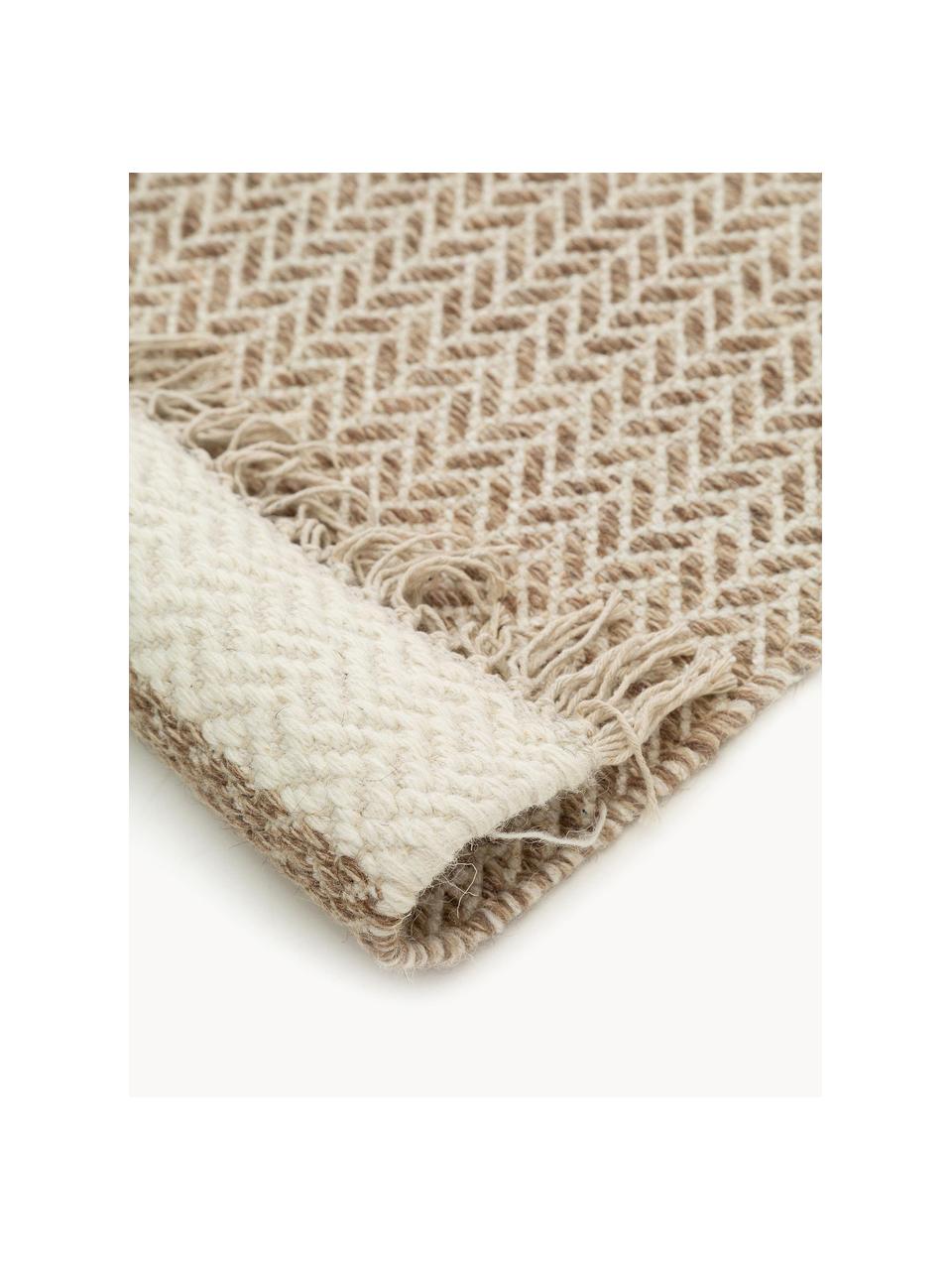 Alfombra artesanal de lana con flecos Kim, 80% algodón, 20% poliéster

Las alfombras de lana se pueden aflojar durante las primeras semanas de uso, la pelusa se reduce con el uso diario., Tonos beige, An 200 x L 300 cm (Tamaño L)