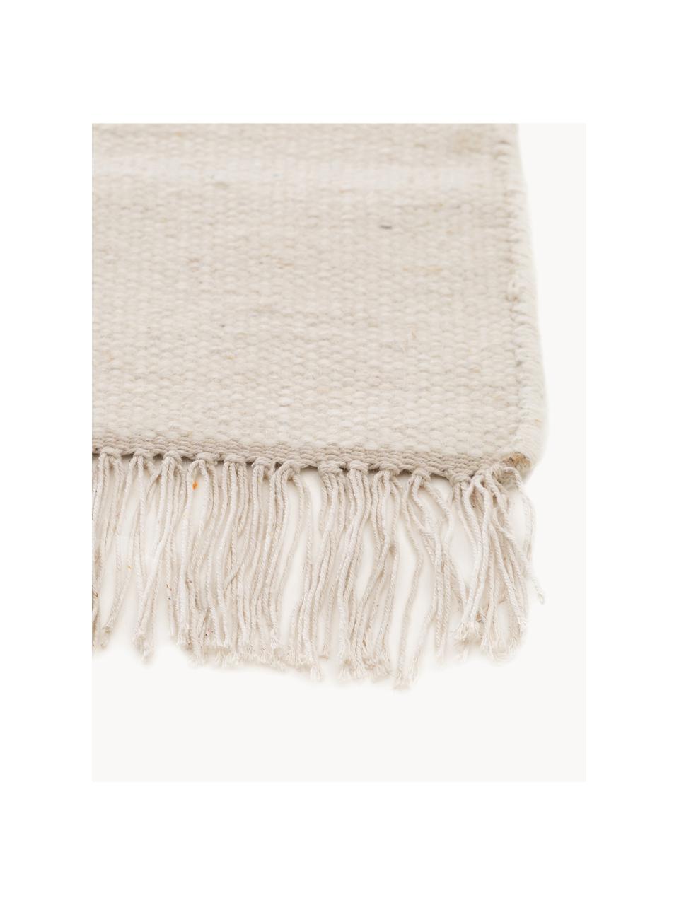 Tapis en laine tissé à la main avec franges Liv, 80 % laine, 20 % coton

Les tapis en laine peuvent perdre des fibres lors des premières semaines et des peluches peuvent se former, ce phénomène est naturel et diminue à mesure de votre usage et du temps, Beige clair, larg. 80 x long. 150 cm (taille XS)