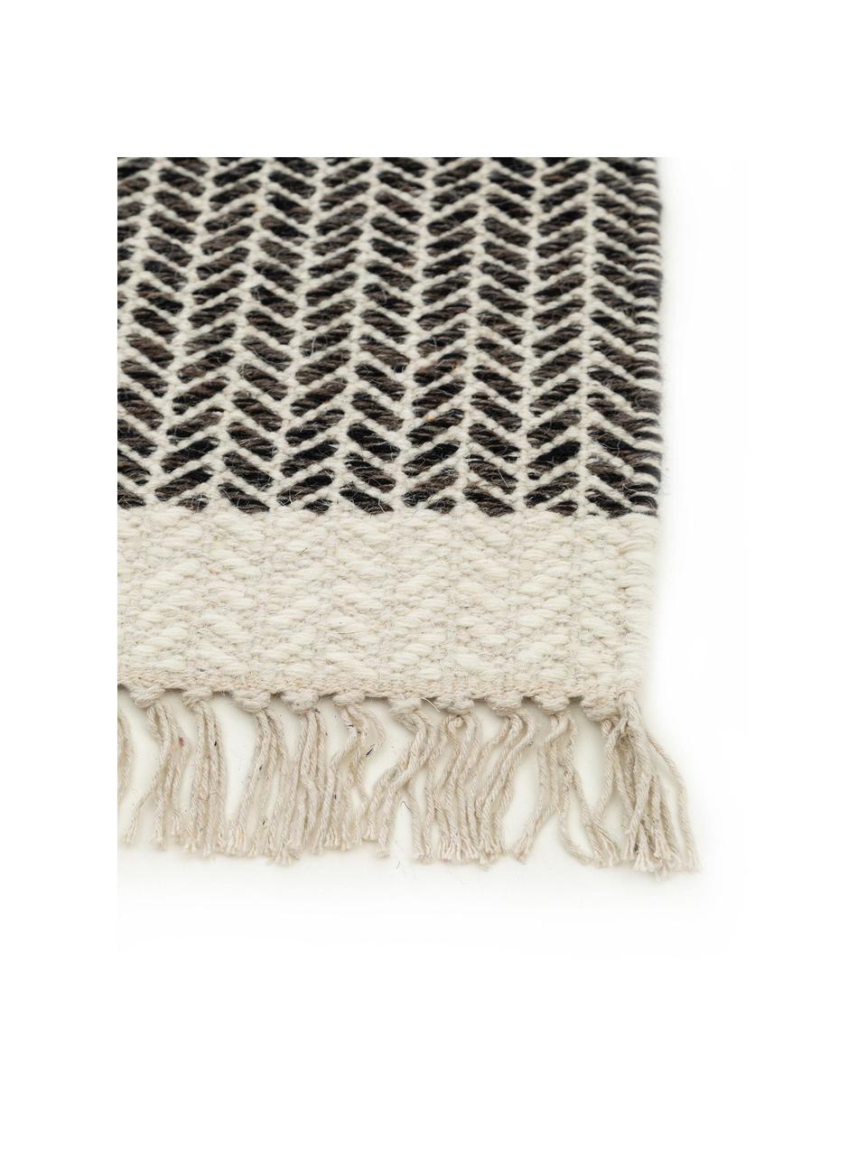 Tapis d'entrée en laine à franges tissé main Kim, 80 % laine, 20 % coton

Les tapis en laine peuvent perdre des fibres lors des premières semaines et des peluches peuvent se former, ce phénomène est naturel et diminue à mesure de votre usage et du temps, Noir, beige, larg. 70 x long. 200 cm