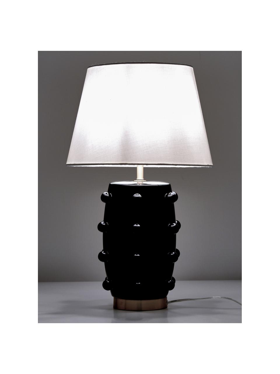Lampada da tavolo in ceramica Leandra, Base della lampada: ceramica, Paralume: tessuto, Base della lampada: nero, ottone Paralume: bianco Cavo: trasparente, Ø 36 x Alt. 57 cm