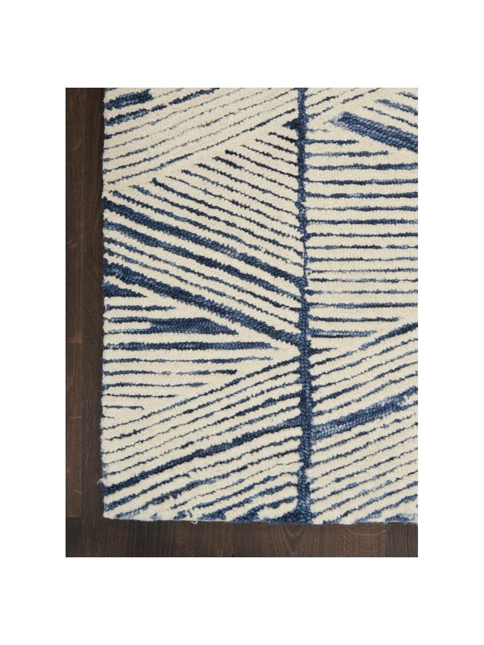 Tapis en laine tissé à la main Colorado, 100 % laine

Les tapis en laine peuvent perdre des fibres lors des premières semaines et des peluches peuvent se former, ce phénomène est naturel et diminue à mesure de votre usage et du temps, Blanc crème, bleu foncé, larg. 120 x long. 180 cm (taille S)