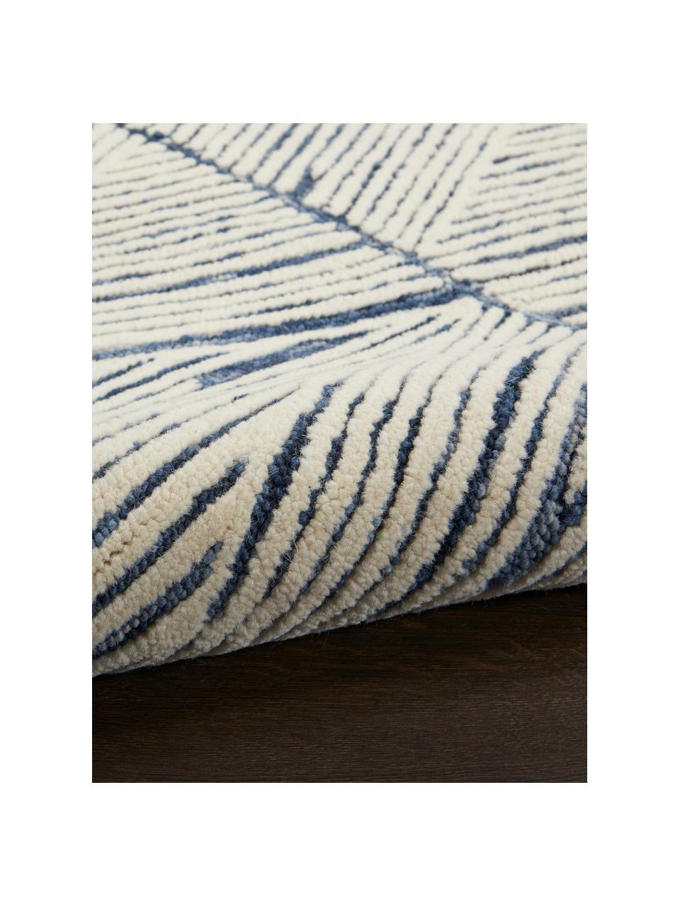 Tapis en laine tissé à la main Colorado, 100 % laine

Les tapis en laine peuvent perdre des fibres lors des premières semaines et des peluches peuvent se former, ce phénomène est naturel et diminue à mesure de votre usage et du temps, Blanc crème, bleu foncé, larg. 120 x long. 180 cm (taille S)