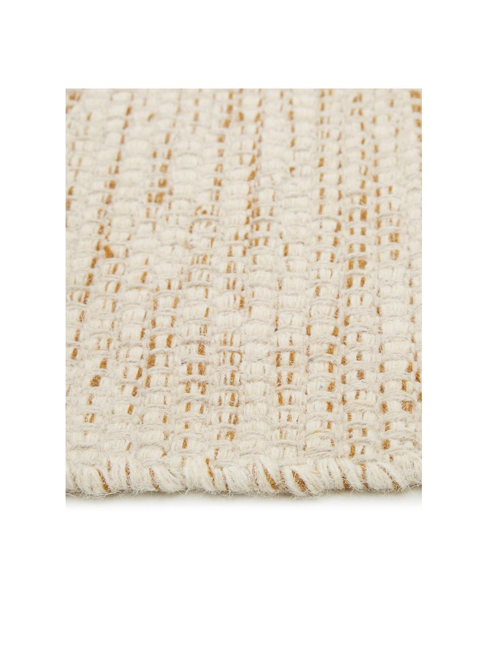 Tappeto in lana con sfumatura beige/gialla tessuto a mano Lule, 70% lana, 30% cotone
Nel caso dei tappeti di lana, le fibre possono staccarsi nelle prime settimane di utilizzo, questo e la formazione di lanugine si riducono con l'uso quotidiano, Giallo ocra, beige, Larg. 170 x Lung. 240 cm  (taglia M)