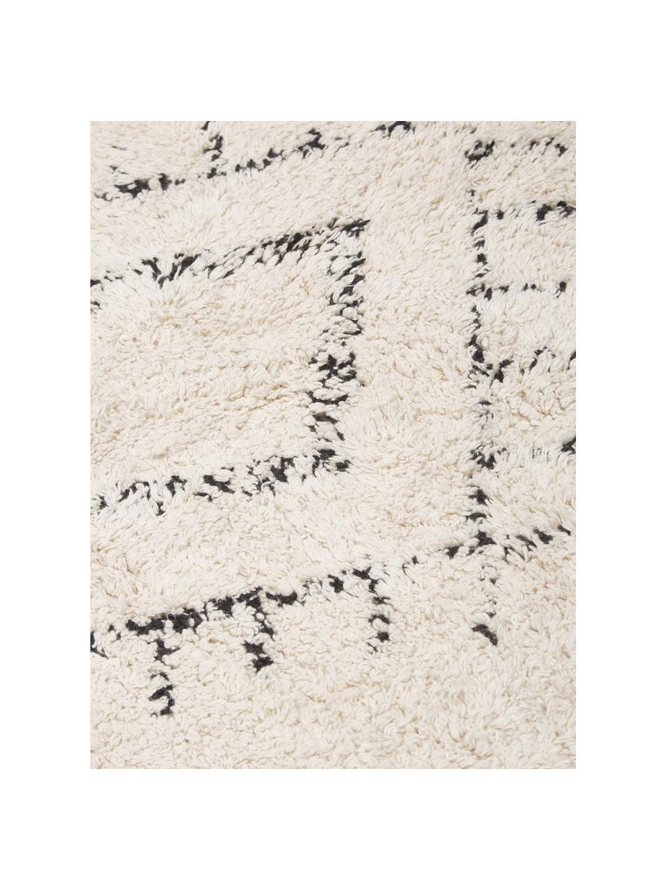 Runder Baumwollteppich Fionn mit Fransen, handgetuftet, Hellbeige, Schwarz, Ø 150 cm (Größe M)