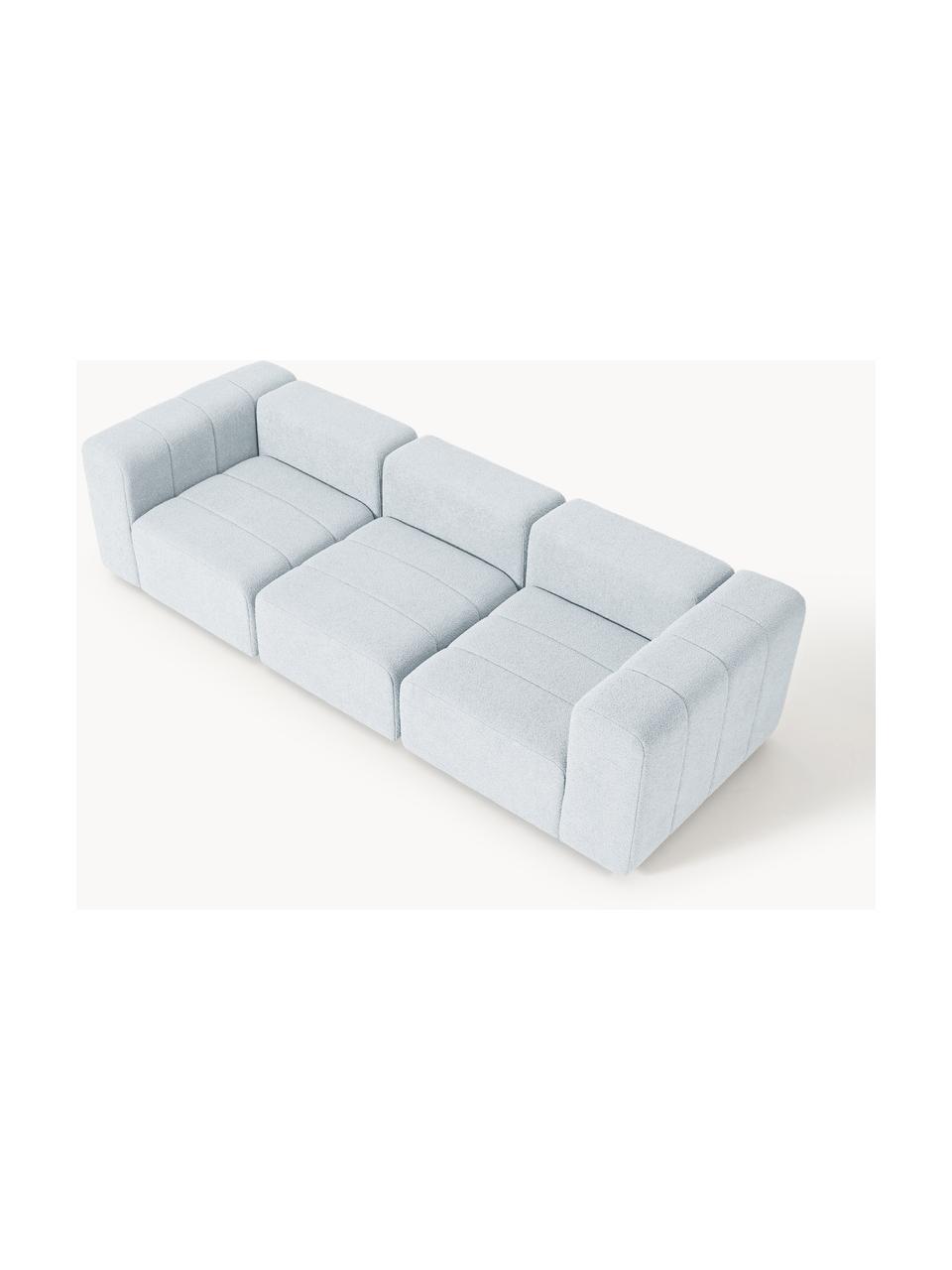 Divano componibile 4 posti in bouclé Lena, Rivestimento: bouclé (93% poliestere, 6, Struttura: legno di faggio, truciola, Piedini: plastica, Bouclé azzurro, Larg. 287 x Prof. 106 cm