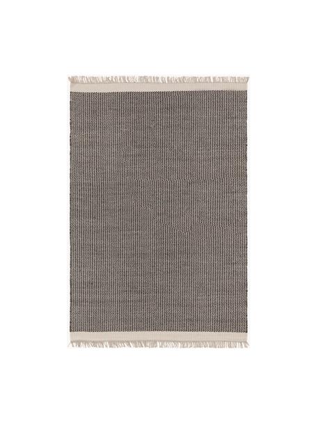 Ręcznie tkany dywan z wełny z frędzlami Kim, 80% wełna, 20% bawełna

Włókna dywanów wełnianych mogą nieznacznie rozluźniać się w pierwszych tygodniach użytkowania, co ustępuje po pewnym czasie, Czarny, beżowy, S 120 x D 170 cm (Rozmiar S)